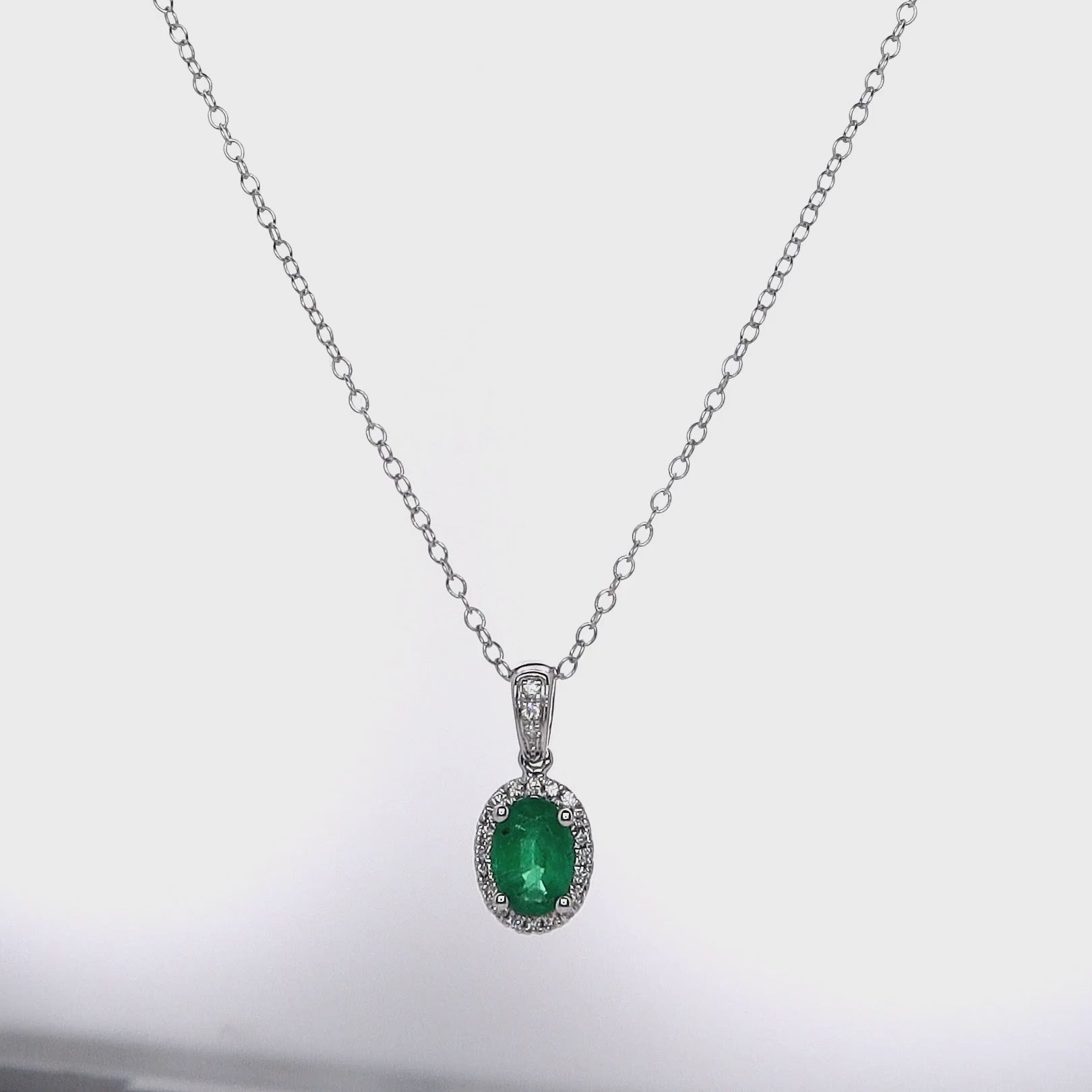 14k White Gold Oval Emerald and Diamond Halo Pendant Necklace